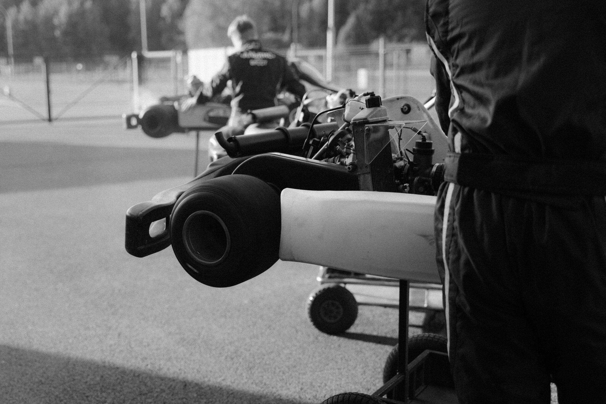 A mechanic adjusting tires during a MotoGP pit stop.