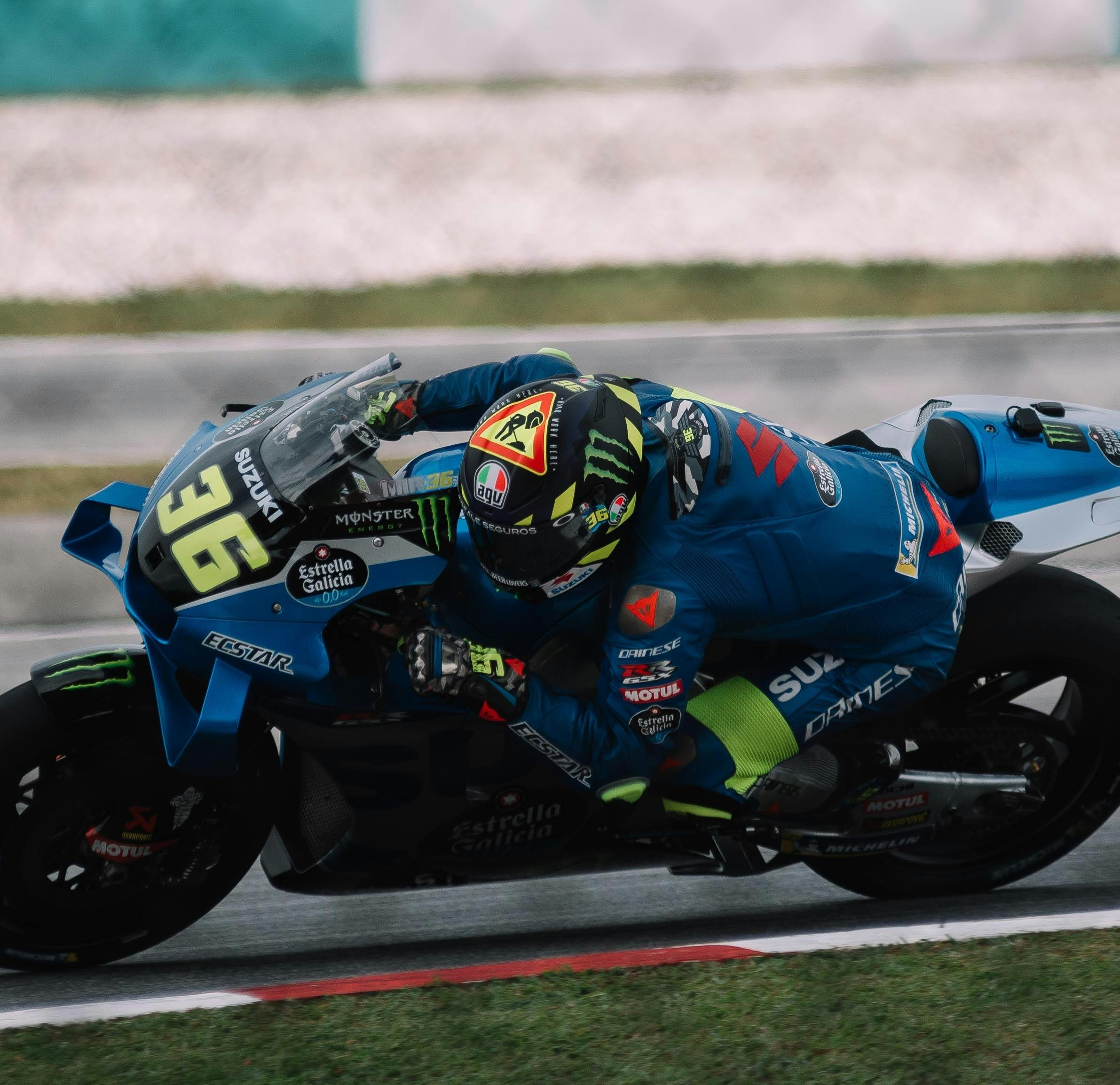 MotoGP rider sliding off their bike during a race