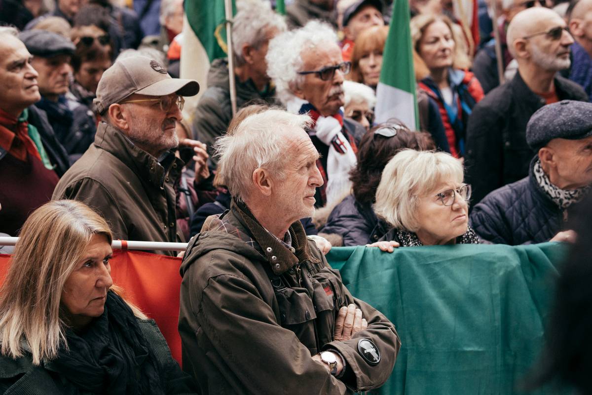 A packed MotoGP grandstand cheering wildly