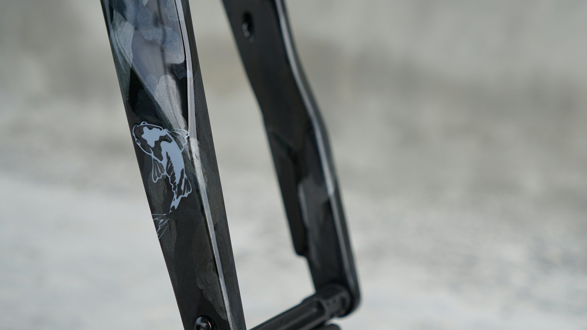 Close-up shot of a MotoGP rider leaning into a tight corner, showcasing chassis stability