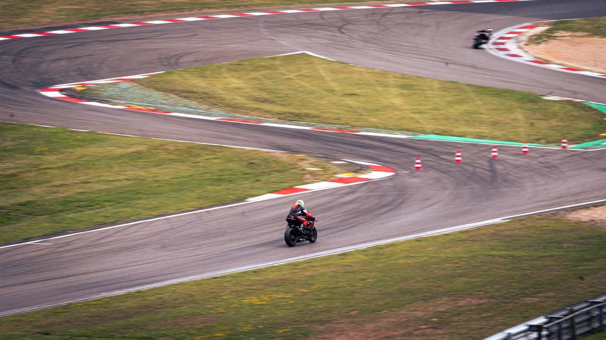 Closeup shot of motorcycles navigating the tight Corkscrew section at Laguna Seca