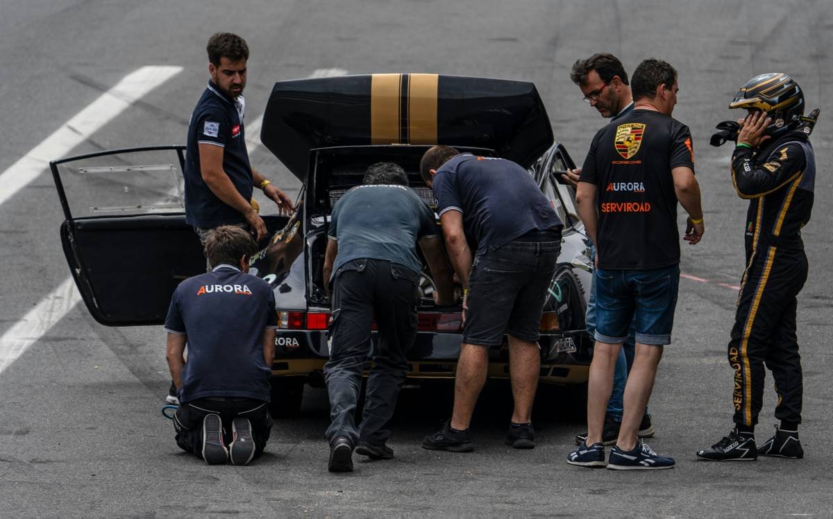 Excited MotoGP fans cheering at a live event