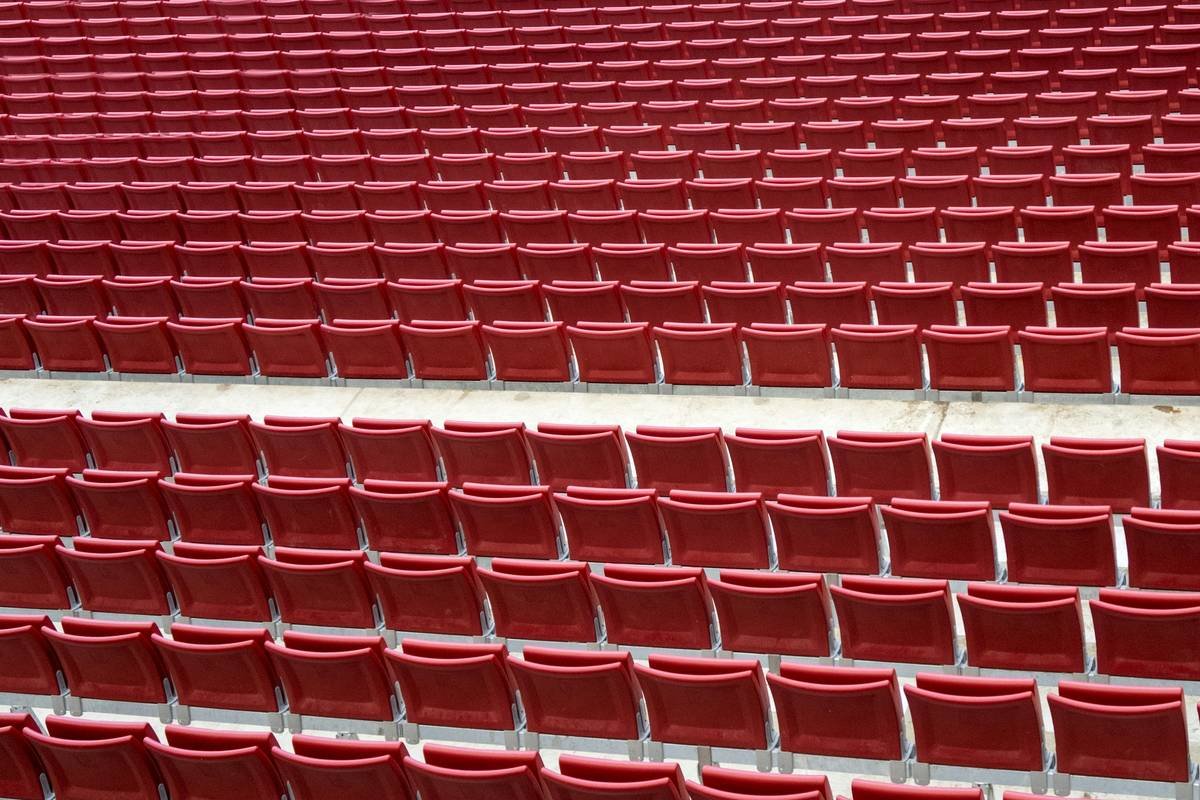 Illustration showing key areas of a MotoGP track layout including grandstands, corners, and pit lanes